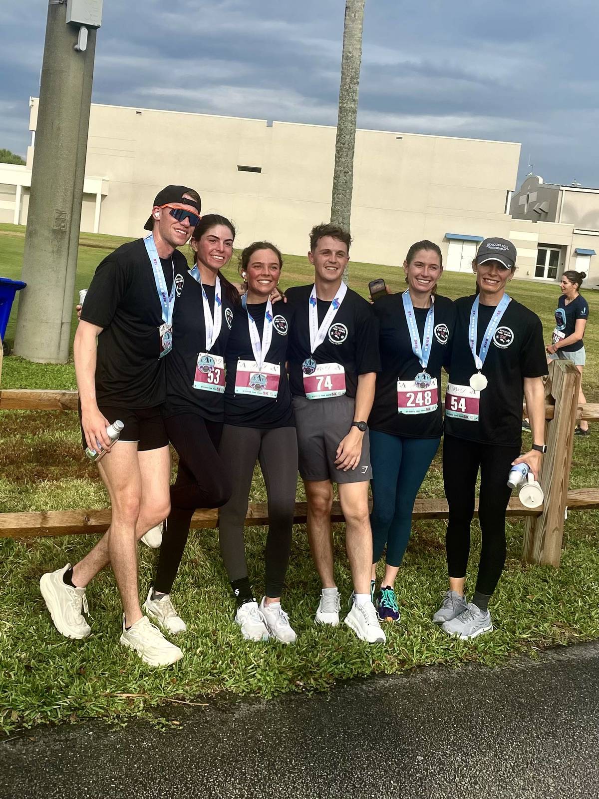 Runners with medals after completing an EAF Strides for Hope 5K