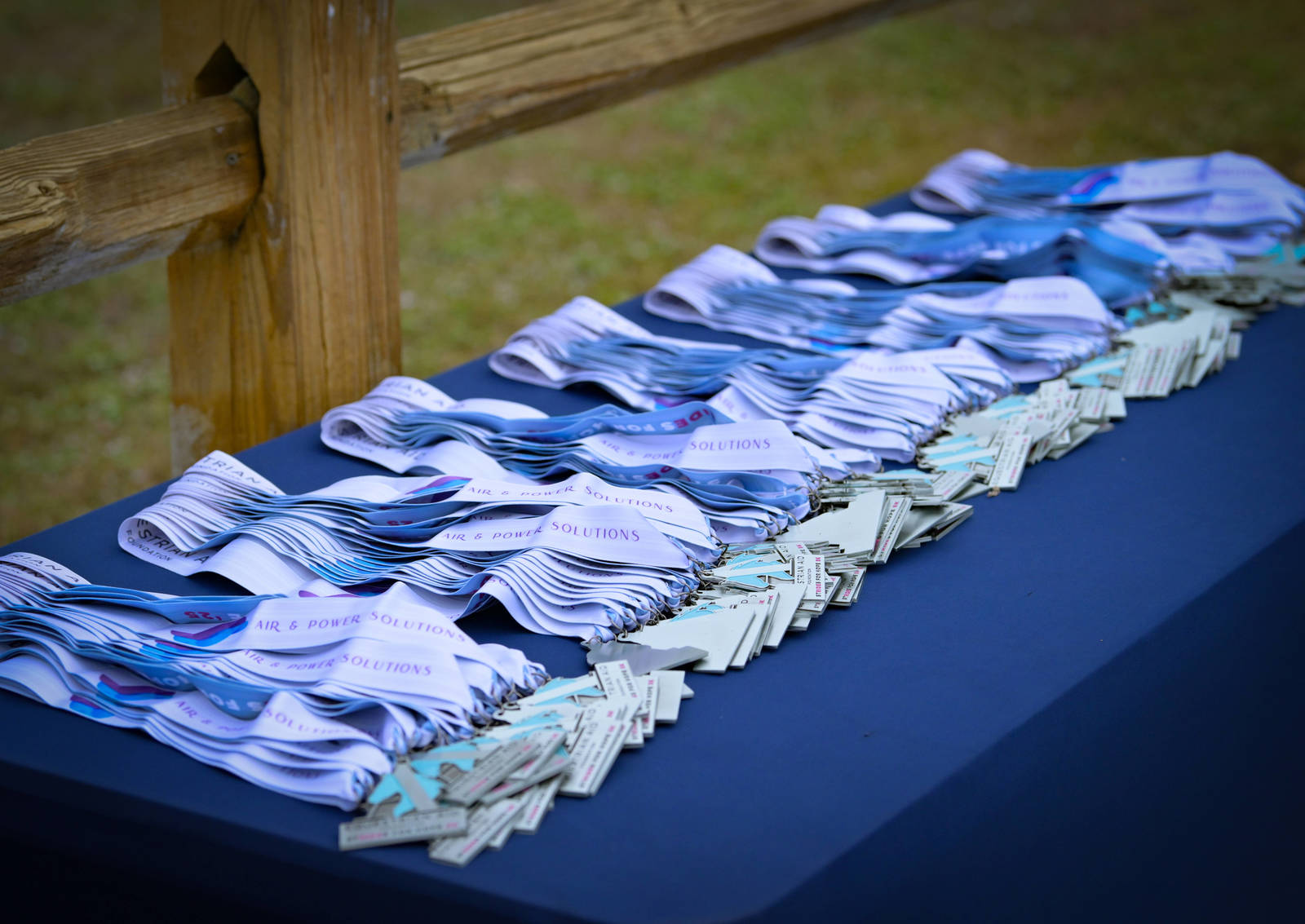 Finisher medals laid out on a table at an EAF benefit race